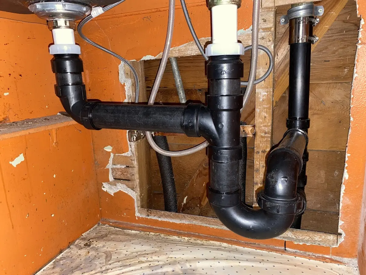 Professional Garbage Disposal Repair equipment and tools on the job in Ipswich